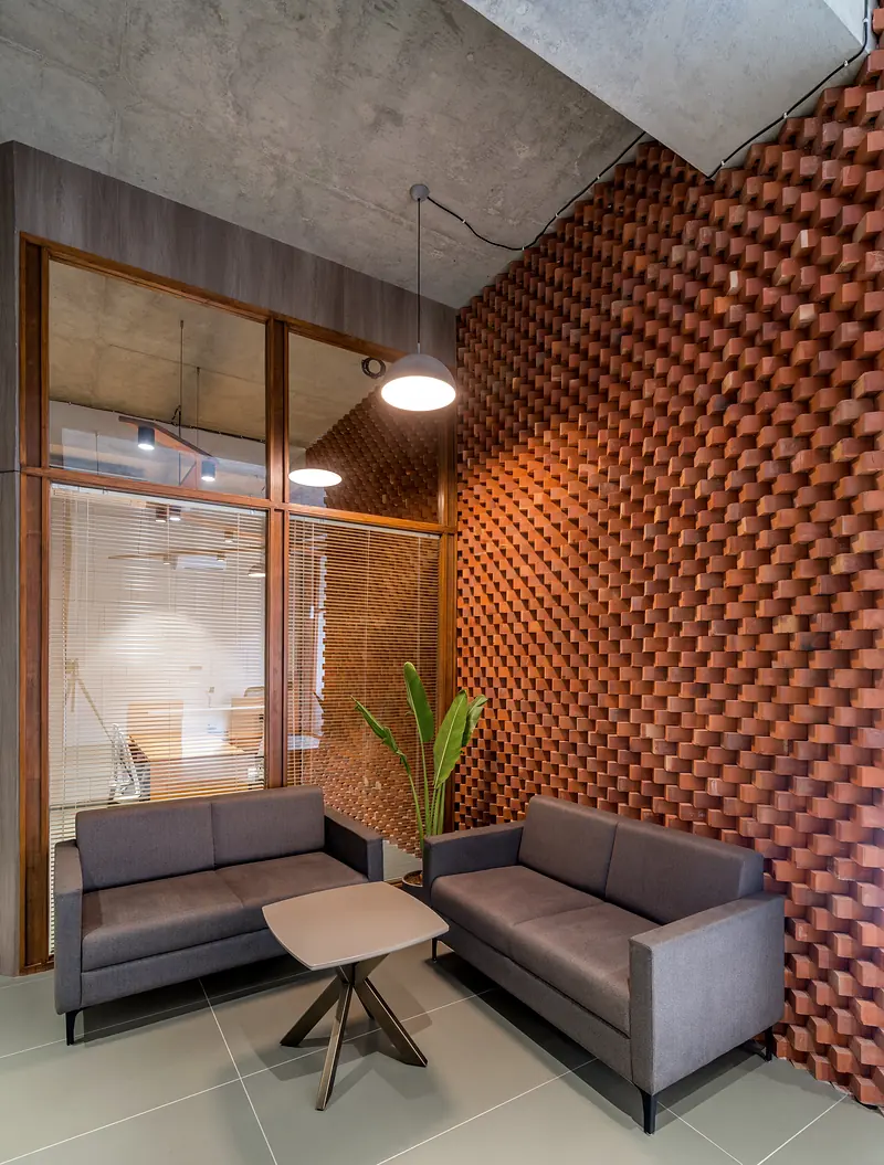 Perforated brick screen wall in a commercial interior